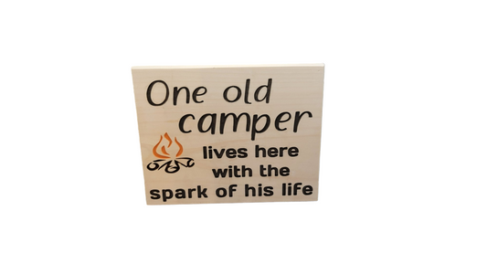 One Old Camper Lives Here with the Spark of His Life Sign