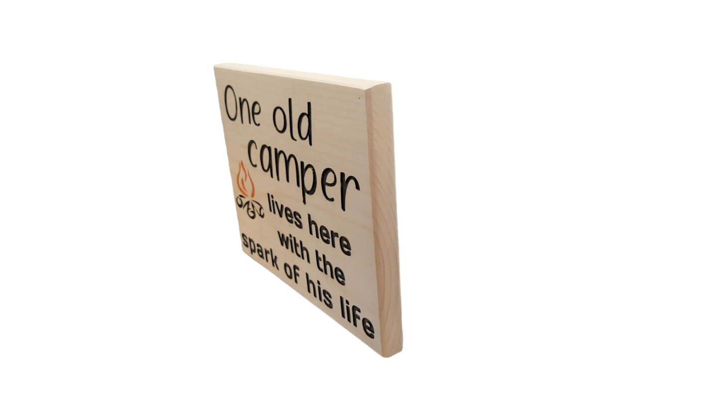 One Old Camper Lives Here with the Spark of His Life Sign
